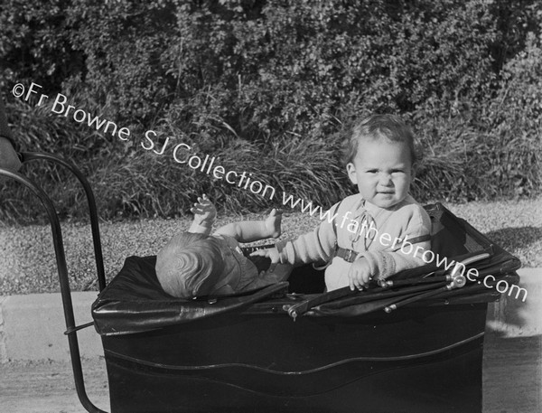 BABY IN PRAM WITH DOLL